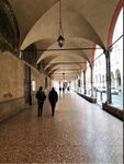 As a result of a high urban migration and arrival of students the porticos in Bologna where built to extend the inner living space. At a certain point the streets where so crowded of porticos that they became a public space. Now this public space, built from a functional point of few is now an important space of human interaction with also a lot of cafés, bars, restaurants and shops. Protecting also from rain and sun. 44°29'37.6”N 11°20'26.9”E