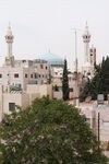 This picture was taken in Jabal Alweibdeh in Amman (31°57'35.3"N 35°54'41.6"E ). From my perspective, this picture has a religious and a socio-cultural symbolic meaning; the religious symbols can be seen in the Christian cross on a church and the crescent on the minaret of a Muslim mosque. The socio-cultural meaning can be perceived by the viewer according to the religious symbolism appearance; in which it emphasizes on the peaceful coexistence between the two religions in Jordan.