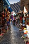 The medina is the historic heart of Tunis, has been listed as a Unesco World Heritage since 1979.It is a labyrinthine ancient city surrounded by a continuous wall.The particularity of the medina of Tunis reamins in its stability;no changes has been made on its structure through the years.This photo represents the souks of medina,the most of theme were built from XIII th century. Covered or uncovered,Souks are enormous; they offer an infinity of colors, flavors and scents.These souks are symbol of the old tunisian architecture.