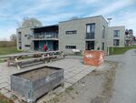 caption: (3) The third picture is of a common area between the student housing where I live. There is a barbeque there and some chairs used by the students living there. But whos responisibility is it to restore and take care of it? Is it the students or the student housing commite?