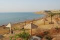 The Dead Sea Beach was mostly public, before it has become a huge investment zone for hotels and resorts to promote therapeutic tourism. After all these investments,the public beach was decreased to 9%, and was abandoned and dirty. Some developments has been made to a small part for the public but entrance fees apply.