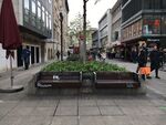 (48° 46' 30.732" N 9° 10' 40.068" E) Photo was taken in Schlossplatz, in the open space in one of the busiest shopping streets in Stuttgart. The landscape symbol identified is the graffiti on benches. Graffiti is not only perceived as a hip-hip culture but also a way for youngsters to express their opinions to the society in recent decades. It is a symbol of the integration of social democracy and public space.